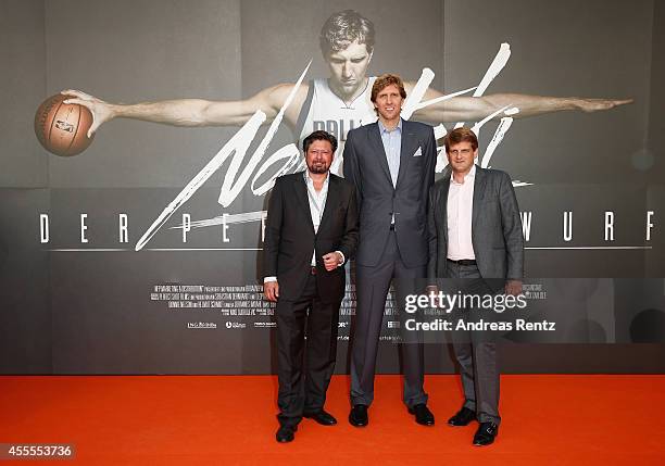 Director Sebastian Dehnhardt, Dirk Nowitzki and producer Leopold Hoesch attend the premiere of the film 'Nowitzki. Der Perfekte Wurf' at Cinedom on...