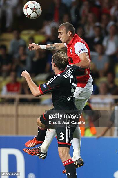 Dimitar Berbatov of Monaco heads the ball over Stefan Reinartz of Bayer Leverkusen during the UEFA Champions League Group C match between AS Monaco...