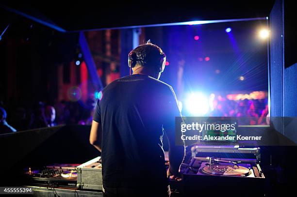 Shepard Fairey DJs during the Hennessy Very Special Limited Edition by Shepard Fairey launch party at Kraftwerk Mitte on September 16, 2014 in...