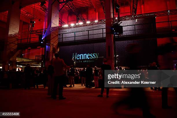 Visitors walk through the Hennessy Very Special Limited Edition by Shepard Fairey launch party at Kraftwerk Mitte on September 16, 2014 in Berlin,...