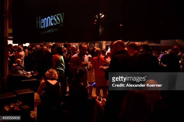 Visitors walk through the Hennessy Very Special Limited Edition by Shepard Fairey launch party at Kraftwerk Mitte on September 16, 2014 in Berlin,...