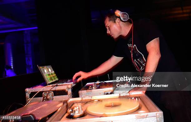 Shepard Fairey DJs during the Hennessy Very Special Limited Edition by Shepard Fairey launch party at Kraftwerk Mitte on September 16, 2014 in...