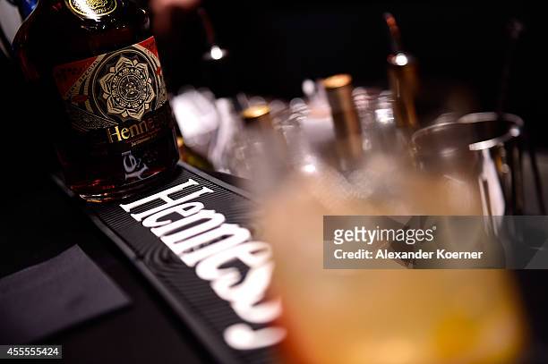 Hennessey cocktails are seen next to a special limited edition bottle during the Hennessy Very Special Limited Edition by Shepard Fairey launch party...
