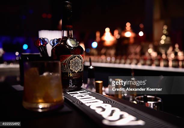Hennessey cocktails are seen next to a special limited edition bottle during the Hennessy Very Special Limited Edition by Shepard Fairey launch party...