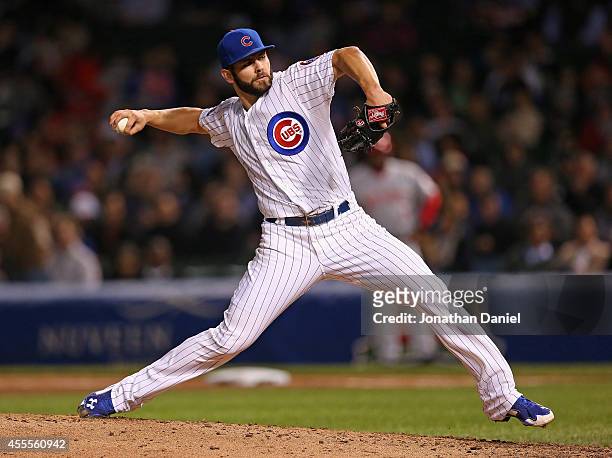 Starting pitcher Jake Arrieta of the Chicago Cubs delivers the ball against the Cincinnati Reds at Wrigley Field on September 16, 2014 in Chicago,...