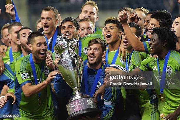 The Seattle Sounders FC celebrate their 3-1 win over the Philadelphia Union for the 2014 U.S. Open Cup Final at PPL Park on September 16, 2014 in...