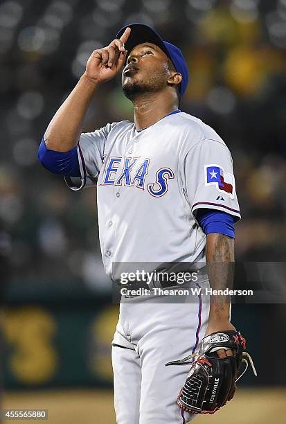 Neftali Feliz of the Texas Rangers celebrates defeating the Oakland Athletics 6-3 at O.co Coliseum on September 16, 2014 in Oakland, California.