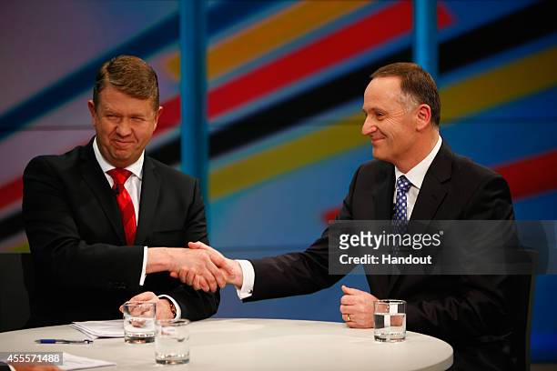 In this handout image provided by TVNZ, Prime Minister John Key and Labour Party leader David Cunliffe shake hands after going head to head at the...