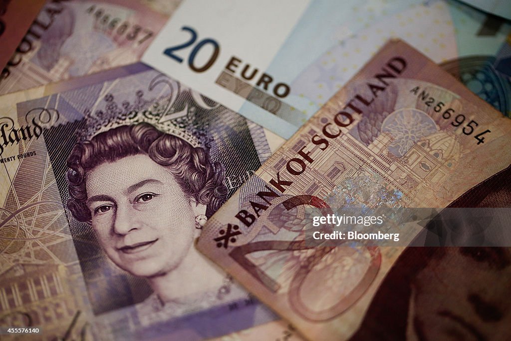 Scottish Sterling Pound Notes And Coins At A Travelex Holdings Ltd. Currency Exchange Store