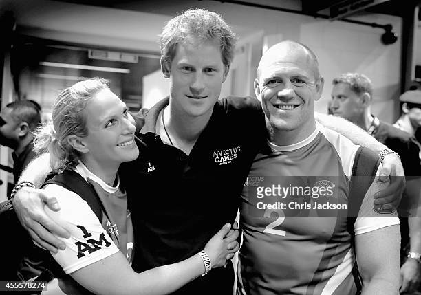 Prince Harry, Zara Phillips and Mike Tindall pose for a photograph after competing in an Exhibition wheelchair rugby match at the Copper Box ahead of...