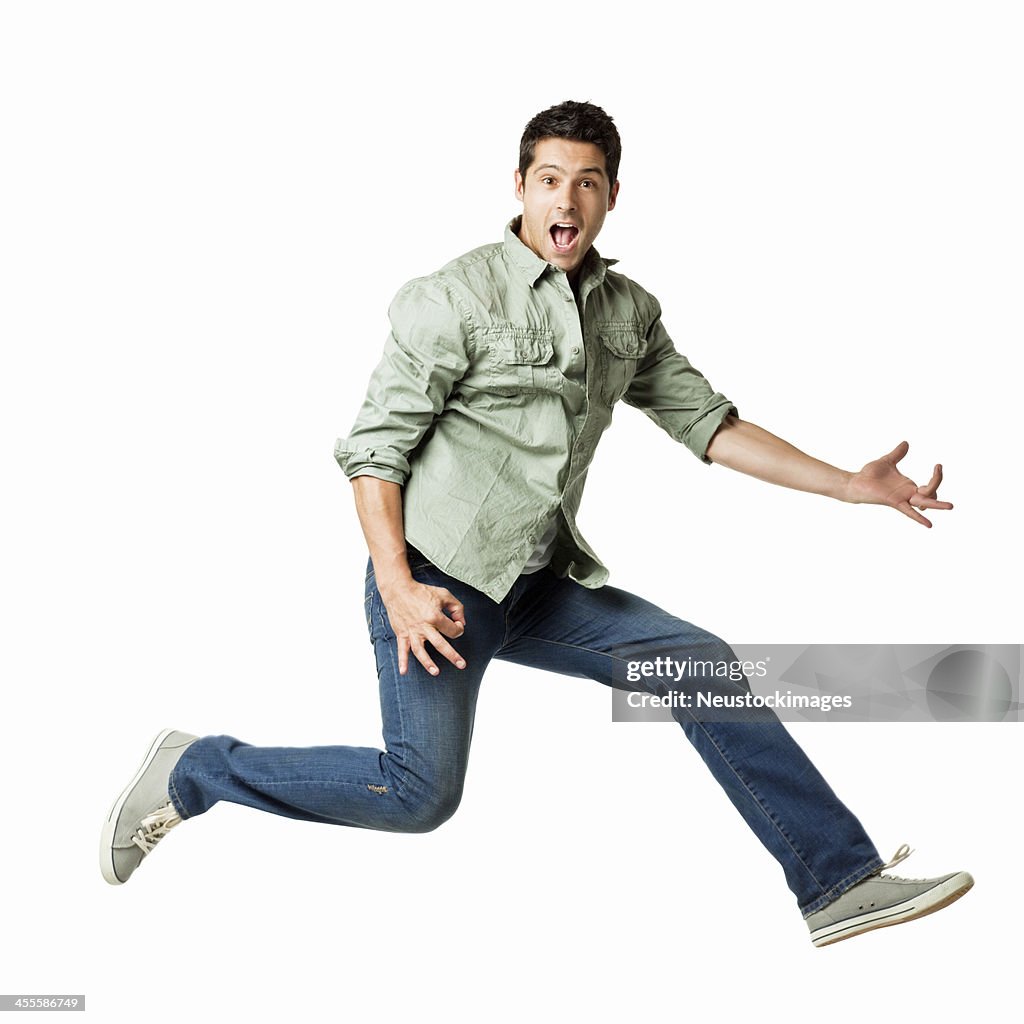 Young Man Playing an Air Guitar - Isolated