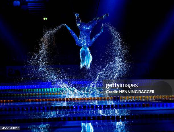 Woman performs at the opening ceremony of the Len European Short Course Swimming Championships in Herning, Denmark on December 12, 2013. AFP PHOTO /...