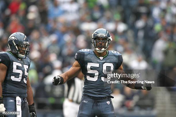 Darry Tapp and Julian Peterson of the Seattle Seahawks look on during game against the Arizona Cardinals on December 9, 2007 at the Centurylink Field...