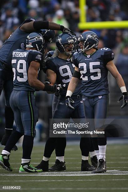 Brian Russell and Julian Peterson of the Seattle Seahawks celebrate after the score against the Arizona Cardinals on December 9, 2007 at Centurylink...