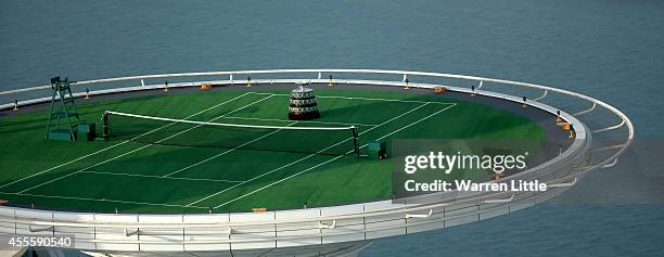 The Davis Cup Trophy is displayed at a unique location at the Burj Al Arab Jumeirah helipad on September 17, 2014 in Dubai, United Arab Emirates. As...