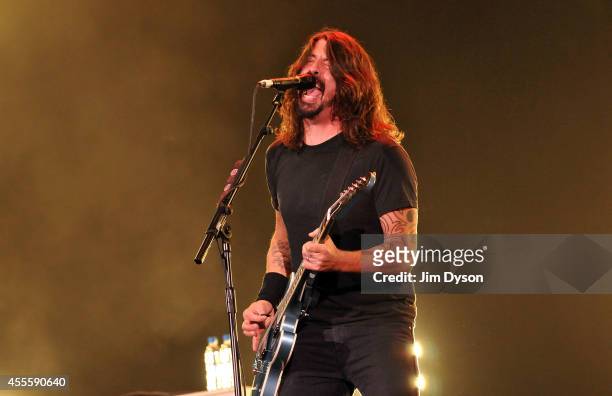Dave Grohl of Foo Fighters performs live on stage at the Invictus Games Closing Concert at Queen Elizabeth Olympic Park on September 14, 2014 in...