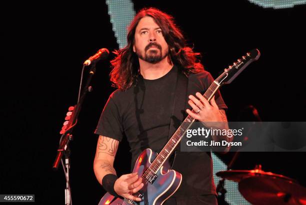 Dave Grohl of Foo Fighters performs live on stage at the Invictus Games Closing Concert at Queen Elizabeth Olympic Park on September 14, 2014 in...