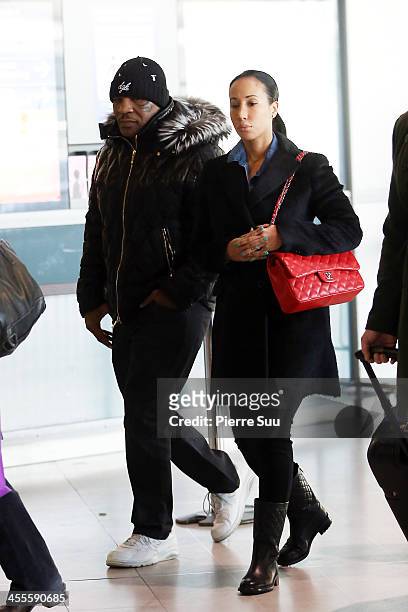 Mike Tyson and his wife Kiki Tyson are seen at Paris Charles de Gaulle Airport departure terminal on December 12, 2013 in Paris, France. Mike Tyson...