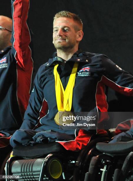 Joe Townsend of Great Britain salutes the crowd after receiving the Jaguar Award for Exceptional Performance during the Invictus Games Closing...
