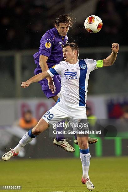 Massimo Ambrosini of ACF Fiorentina fights for the ball with Ruslan Rotan of FC Dnipro Dnipropetrovsk during the UEFA Europa League Group E match...