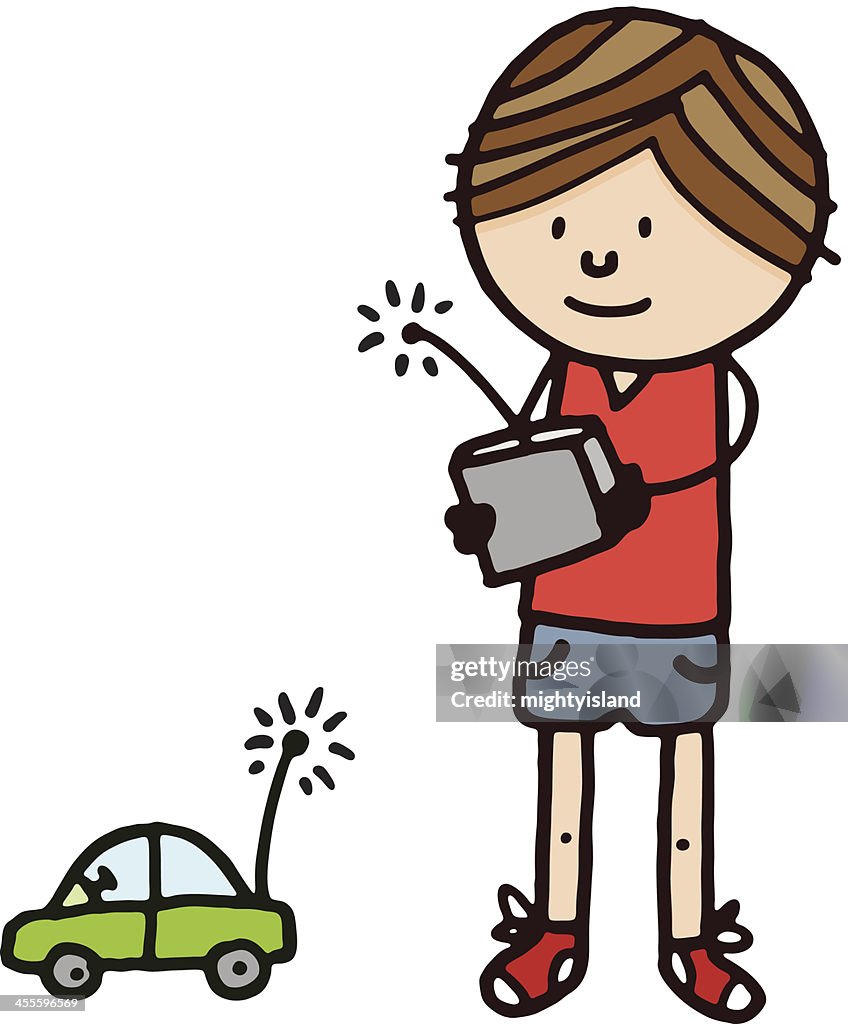 Boy playing with radio controlled car