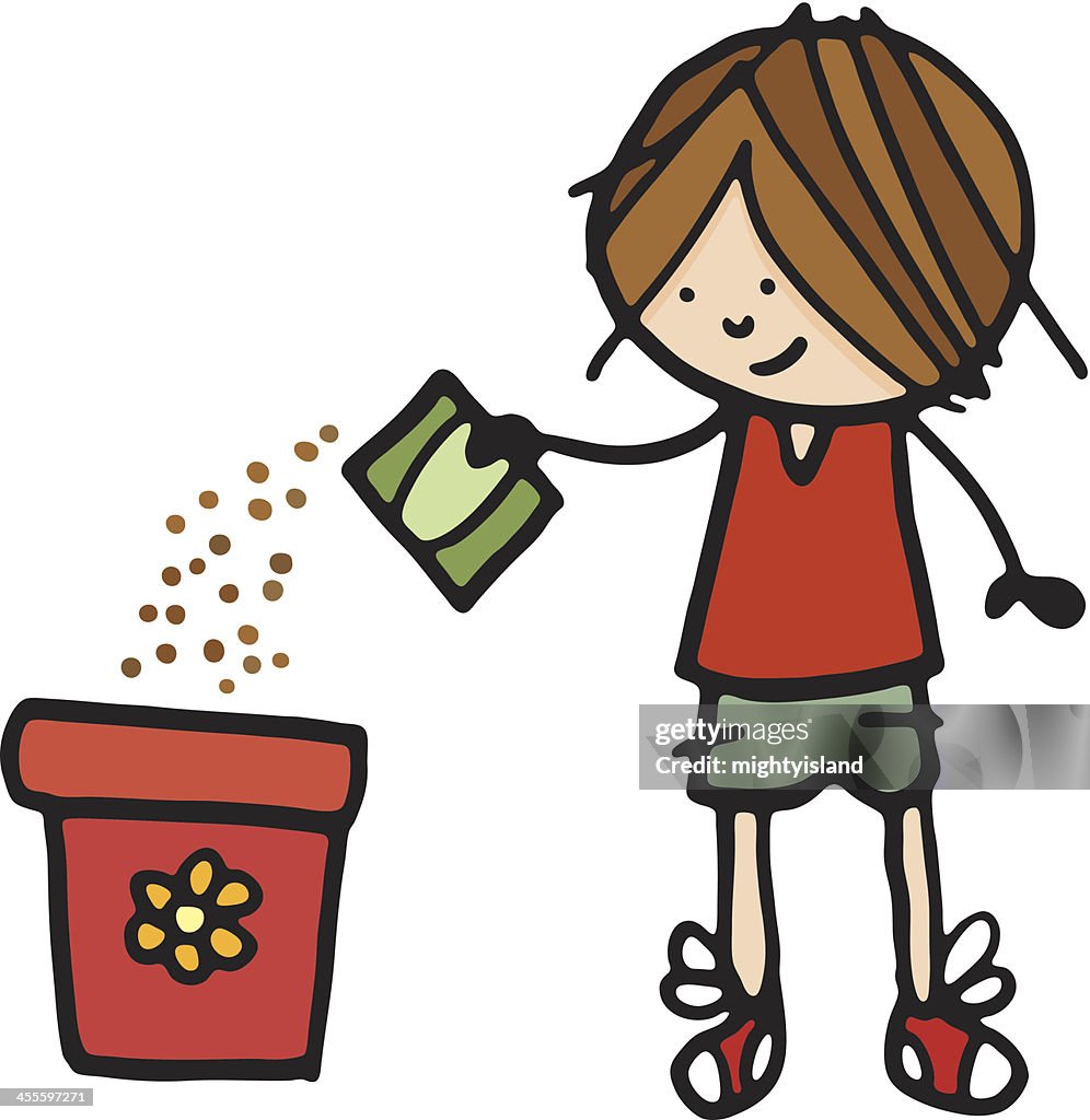 Boy sowing seeds into a plant pot