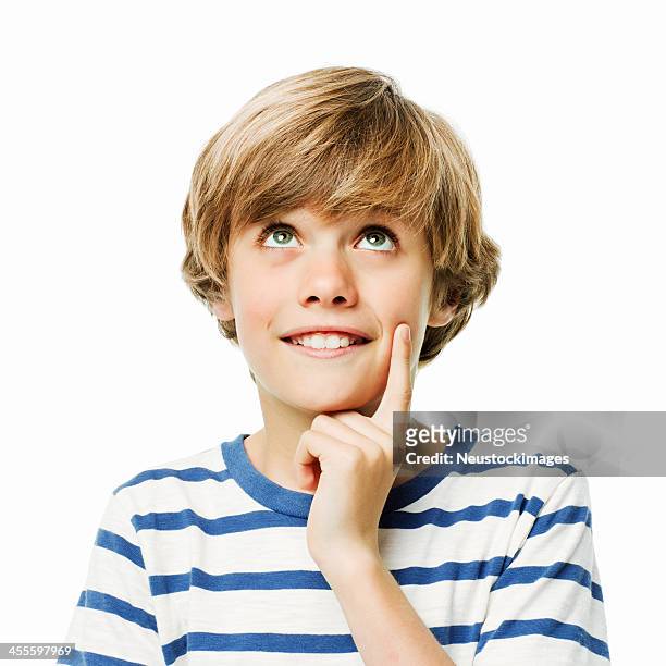 young boy in thought - isolated - boy wondering stock pictures, royalty-free photos & images