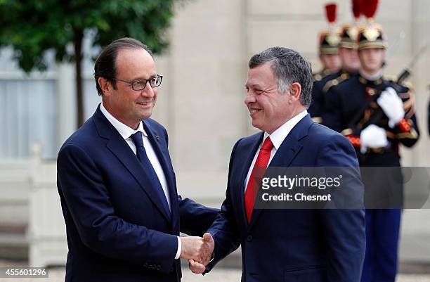 French President Francois Hollande welcomes King Abdallah II of Jordan prior a meeting at Elysee Palace on September 17 in Paris, France.