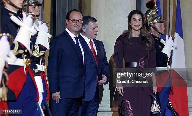 French President Francois Hollande welcomes King Abdallah II of Jordan and Queen Rania Al Abdullah of Jordan prior to a working dinner at Elysee...