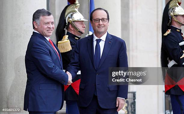 French President Francois Hollande welcomes King Abdallah II of Jordan prior a meeting at Elysee Palace on September 17 in Paris, France.