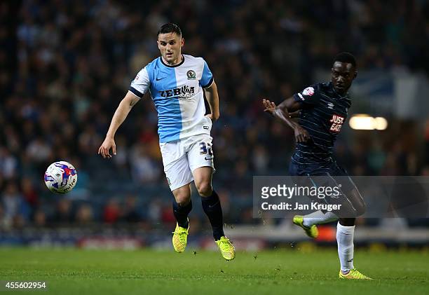 Craig Conway of Blackburn Rovers controls the ball from Simon Dawkins of Derby County during the Sky Bet Championship match between Blackburn Rovers...