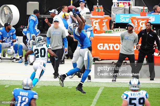Calvin Johnson of the Detroit Lions makes a catch against Antoine Cason of the Carolina Panthers at Bank of America Stadium on September 14, 2014 in...