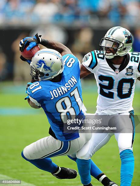 Calvin Johnson of the Detroit Lions makes a catch against Antoine Cason of the Carolina Panthers at Bank of America Stadium on September 14, 2014 in...