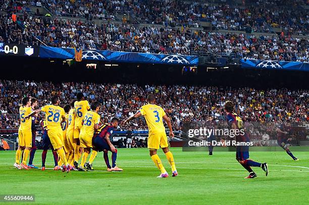 Lionel Messi of FC Barcelona takes a free kick during the UEFA Champions League Group F match between FC Barcelona and APOEL FC at the Camp Nou...