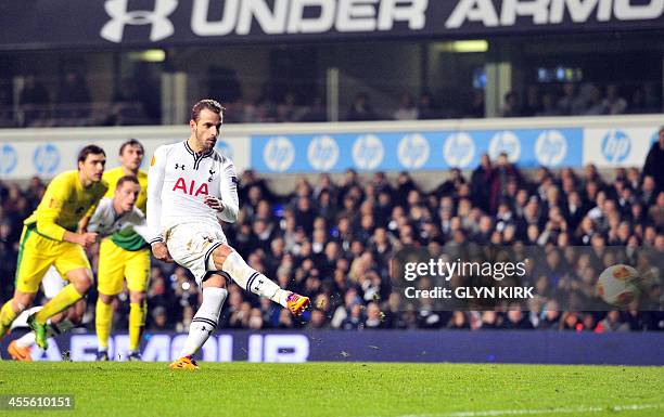 Tottenham Hotspur's Spanish striker Roberto Soldado scores a penalty shot during the UEFA Europa League Group K football match Tottenham vs Anzhi...