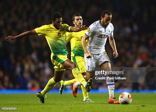 Jucilei of Anzhi Makhachkala tackles Andros Townsend of Tottenham Hotspur during the UEFA Europa League Group K match between Tottenham Hotspur FC...