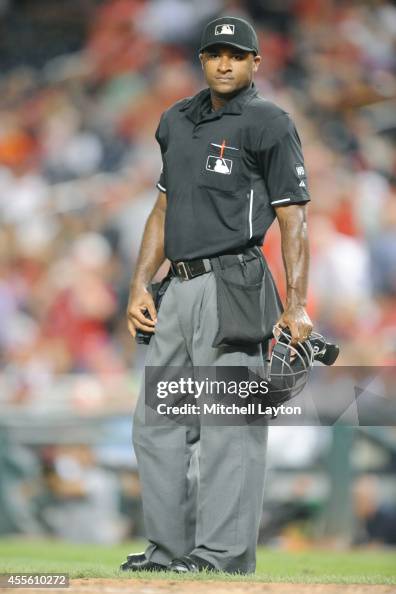 Umpire Alan Porter looks on during a baseball game between the... News Umpire Alan Porter looks on during a baseball game between the... News