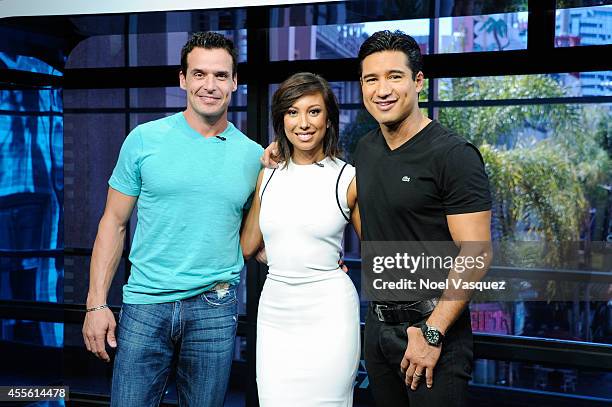 Antonio Sabato Jr., Cheryl Burke and Mario Lopez visit "Extra" at Universal Studios Hollywood on September 17, 2014 in Universal City, California.