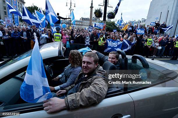 Yes'' campaigners drive through George Square at a ''Yes'' rally during the final day of campaigning for the Scottish referendum ahead of tomorrows...