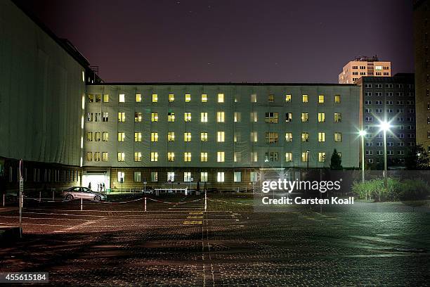 Buildings of the archives of the former East German secret police, known as the Stasi, are illuminated on September 17, 2014 in Berlin, Germany. The...