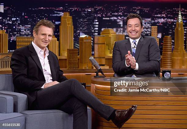 Liam Neeson and host Jimmy Fallon during a segment of "The Tonight Show Starring Jimmy Fallon" at Rockefeller Center on September 17, 2014 in New...