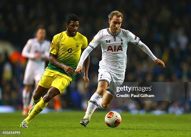 Christian Eriksen of Tottenham Hotspur is closed down by Jucilei of Anzhi Makhachkala during the UEFA Europa League Group K match between Tottenham...