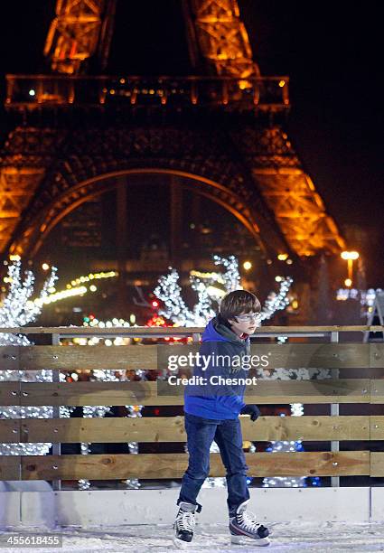 People skate on an ice skating rink across from the Eiffel Tower on December 12, 2013 in Paris, France. The event inaugurates the traditional Noel...