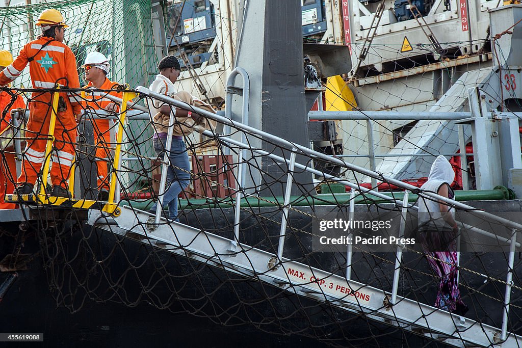 105 migrants arrived in Palermo, Italy, aboard a merchant...