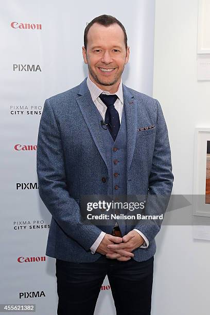 Donnie Wahlberg reveals his photographs printed on the Canon PIXMA PRO printers at the Canon PIXMA PRO City Senses Gallery at EpiCenter in Boston on...