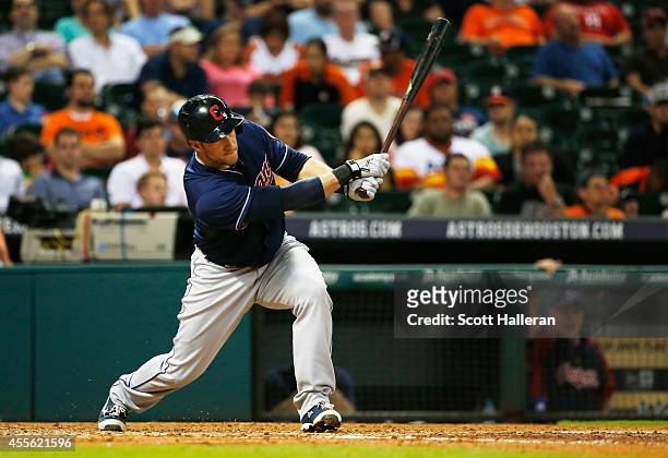 Yan Gomes#10 of the Cleveland Indians connects for a RBI single in the fourth inning against the Houston Astros during their game at Minute Maid Park...