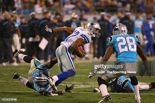 Jon Beason of the Carolina Panthers makes a tackle during a game against the Dallas Cowboys on December 22, 2007 at the Bank of America Stadium in...