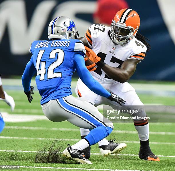 Tight end MarQueis Gray of the Cleveland Browns attempts to avoid being tackled by defensive back Isa Abdul-Quddus of the Detroit Lions during a game...