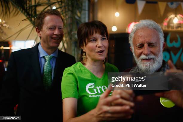 Green Party co-leader Russel Norman , and supporter Lucy Lawless take a photo with a guest during the Green Party election campaign event at St...