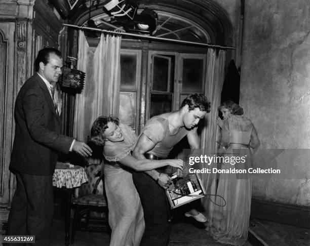 Actor Marlon Brando wrestles with Kim Hunter while Karl Malden and Vivien Leigh watch, on the set of the movie 'A Streetcar Named Desire' which came...